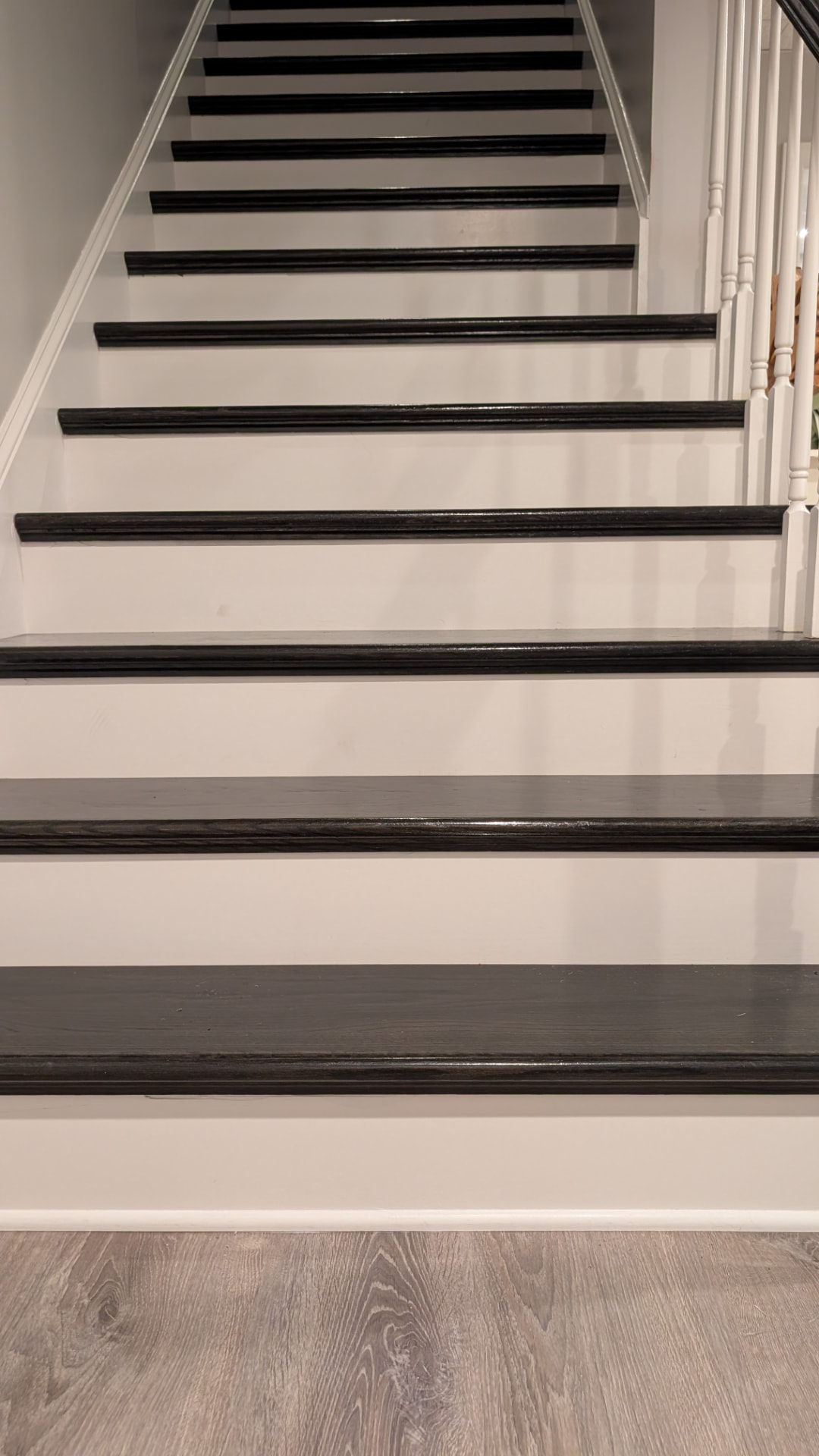 Flooring — Hardwood treads on basement stairs